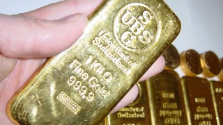 Gold Moves off Lows on Data and Dollar